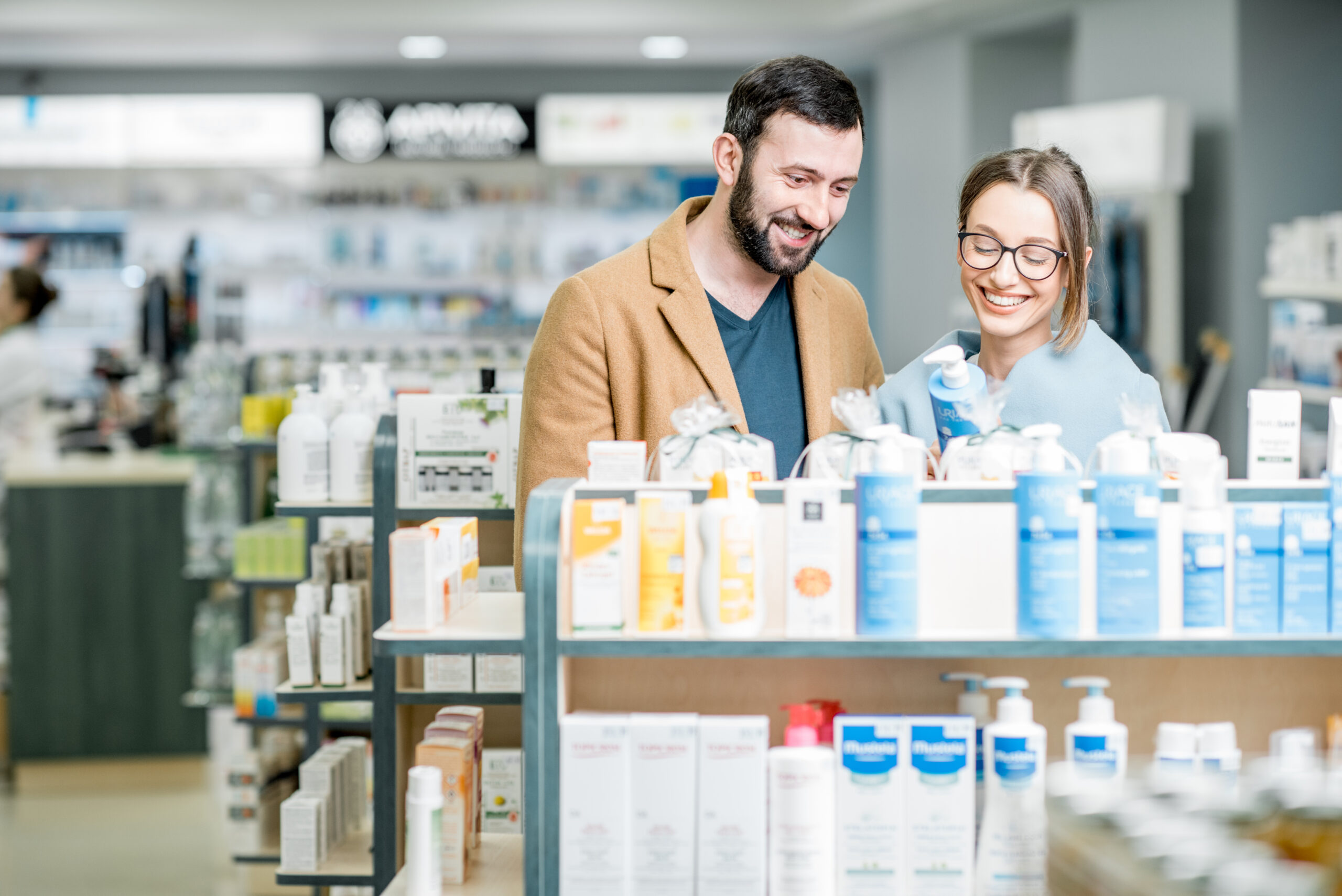 Couple choosing cosmetics in the pharmacy